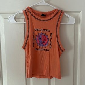 Orange moon and sun crop tank